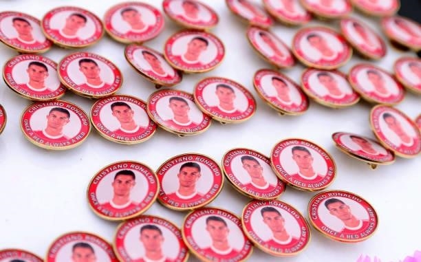 Pin badges with the face of Cristiano Ronaldo of Manchester United are seen being sold outside the stadium prior to the Premier League match between...