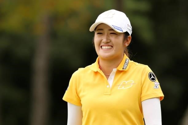 Mone Inami of Japan smiles after the birdie on the 11th green during the final round of the JLPGA Championship Konica Minolta Cup at Shizu Hills...