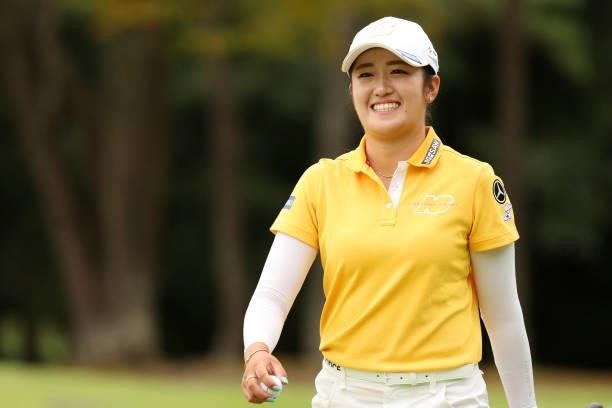Mone Inami of Japan smiles after the birdie on the 11th green during the final round of the JLPGA Championship Konica Minolta Cup at Shizu Hills...
