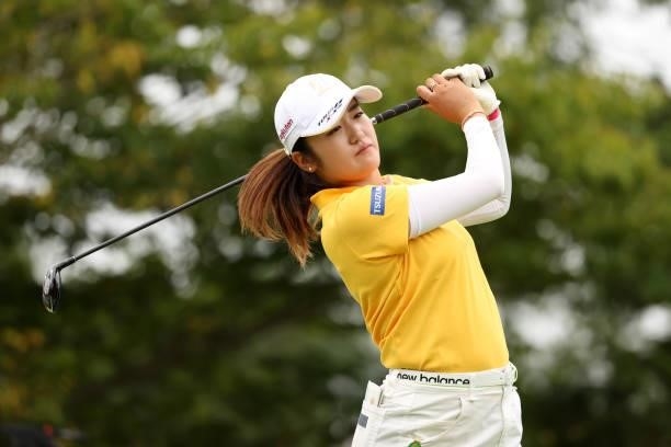 Mone Inami of Japan hits her tee shot on the 12th hole during the final round of the JLPGA Championship Konica Minolta Cup at Shizu Hills Country...