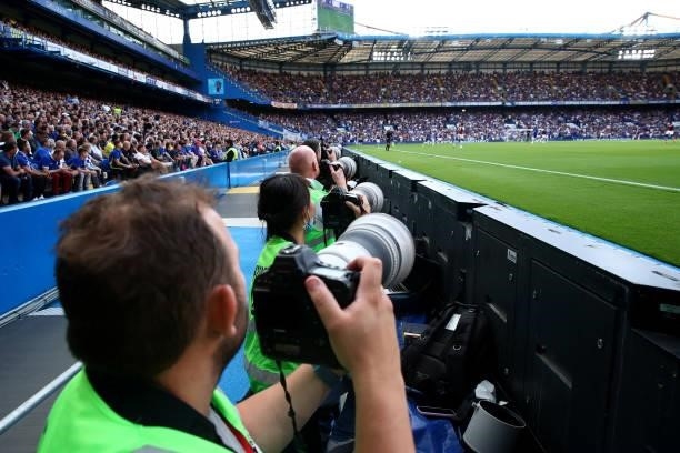 Photographers are seen during the Premier League match between Chelsea and Aston Villa at Stamford Bridge on September 11, 2021 in London, England.