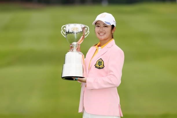 Mone Inami of Japan poses with the trophy after winning the tournament following the final round of the JLPGA Championship Konica Minolta Cup at...