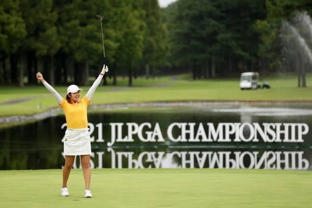 Mone Inami of Japan celebrates winning the tournament on the 18th green during the final round of the JLPGA Championship Konica Minolta Cup at Shizu...