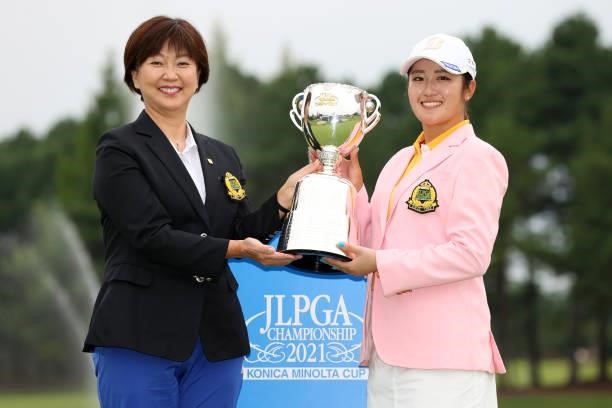 Mone Inami of Japan poses JLPGA President Hiromi Kobayashi after winning the tournament following the final round of the JLPGA Championship Konica...