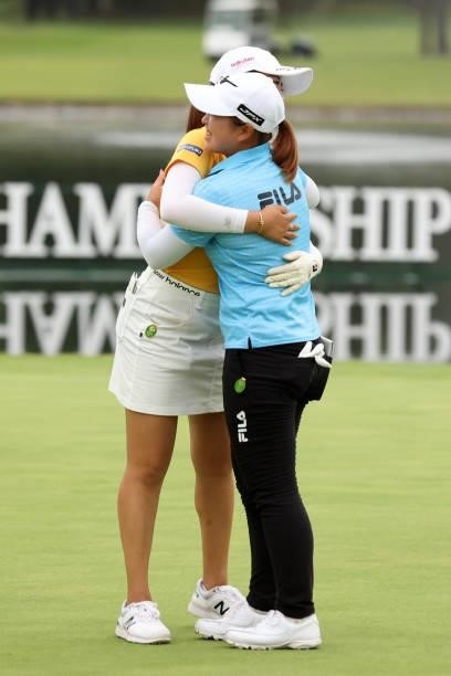 Mone Inami of Japan is congratulated by Mao Saigo after winning the tournament on the 18th green during the final round of the JLPGA Championship...
