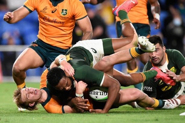 Tate McDermott of the Wallabies holds up Lukhanyo Am of the Springboks in goal during the Rugby Championship match between the South Africa...