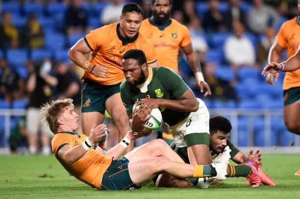Tate McDermott of the Wallabies holds up Lukhanyo Am of the Springboks in goal during the Rugby Championship match between the South Africa...
