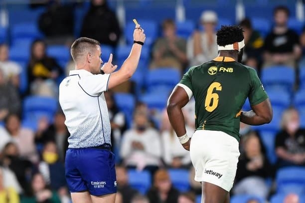 Referee Luke Pearce gives a yellow card to Siya Kolisi of the Springboks during the Rugby Championship match between the South Africa Springboks and...