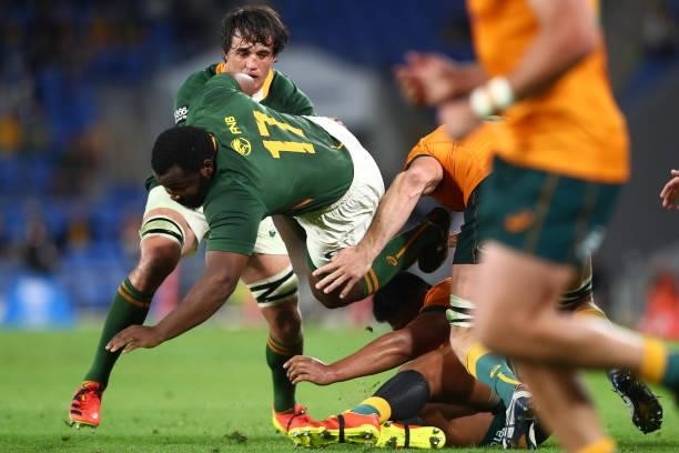 Ox Nché of South Africa charges forward over the top of Folau Fainga’a of the Wallabies during the Rugby Championship match between the South Africa...