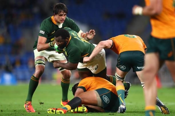 Ox Nché of South Africa charges forward over the top of Folau Fainga’a of the Wallabies during the Rugby Championship match between the South Africa...