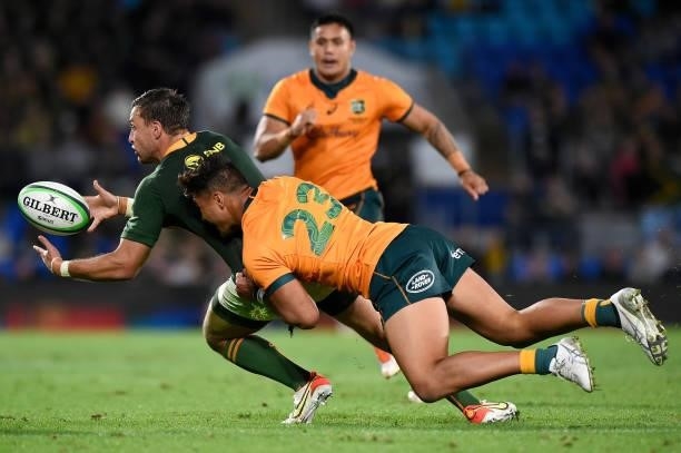 Handré Pollard of the Springboks is tackled by Jordan Petaia of the Wallabies during the Rugby Championship match between the South Africa Springboks...
