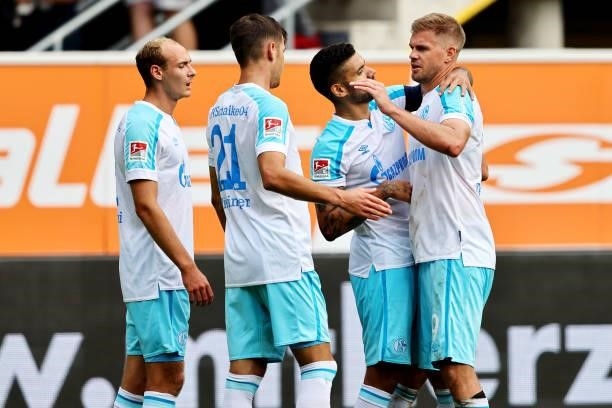Florian Flick, Victor Palsson, Simon Terodde and Marvin Pieringer of Schalke celebrate after winning 1-0 the Second Bundesliga match between SC...