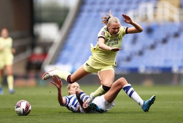 Frida Maanum of Arsenal is challenged by Justine Vanhaevermaet of Reading during the Barclays FA Women's Super League match between Reading Women and...