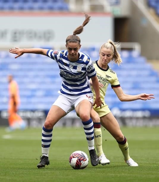 Emma Harries of Reading is challenged by Leah Williamson of Arsenal during the Barclays FA Women's Super League match between Reading Women and...