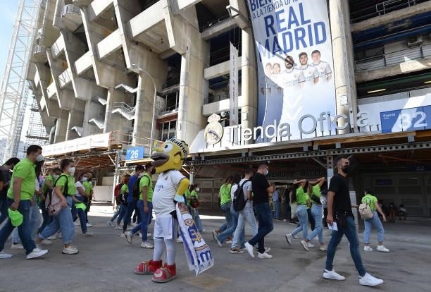 Fans arrive at the Santiago Bernabeu stadium ahead of the La Liga Santander match between Real Madrid CF and RC Celta de Vigo at Estadio Santiago...