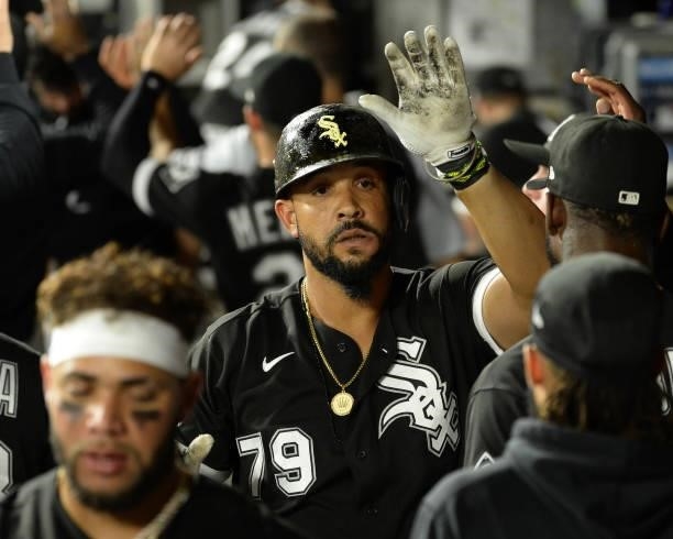 Jose Abreu of the Chicago White Sox celebrates with teammates after hitting a three-run home run in the third inning against the Boston Red Sox on...