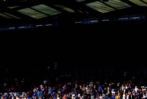 Chelsea fans sit inside the stadium during the Premier League match between Chelsea and Aston Villa at Stamford Bridge on September 11, 2021 in...