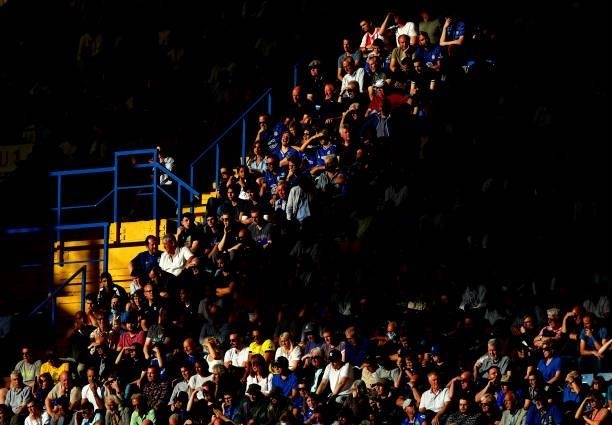 Chelsea fans sit inside the stadium during the Premier League match between Chelsea and Aston Villa at Stamford Bridge on September 11, 2021 in...