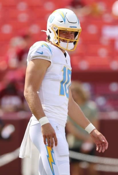 Justin Herbert of the Los Angeles Chargers looks on prior to the game against the Washington Football Team at FedExField on September 12, 2021 in...