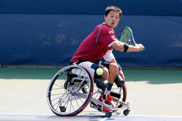 Shingo Kunieda of Japan returns the ball against Alfie Hewett of Great Britain during his Wheelchair Men's Singles final match on Day Fourteen of the...