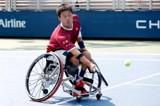 Shingo Kunieda of Japan returns the ball against Alfie Hewett of Great Britain during his Wheelchair Men's Singles final match on Day Fourteen of the...