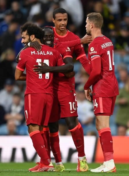 Sadio Mane of Liverpool celebrates with Mohamed Salah after scoring their side's third goal during the Premier League match between Leeds United and...