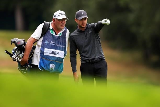 Laurie Canter of England and caddie Gary Tilson line up a shot during Day Four of The BMW PGA Championship at Wentworth Golf Club on September 12,...