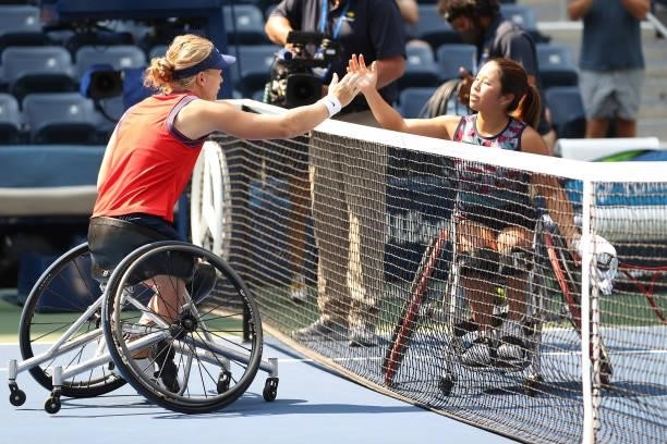 Diede de Groot of the Netherlands shakes hands with Yui Kamiji of Japan after winning their Wheelchair Women's Singles final match on Day Fourteen of...