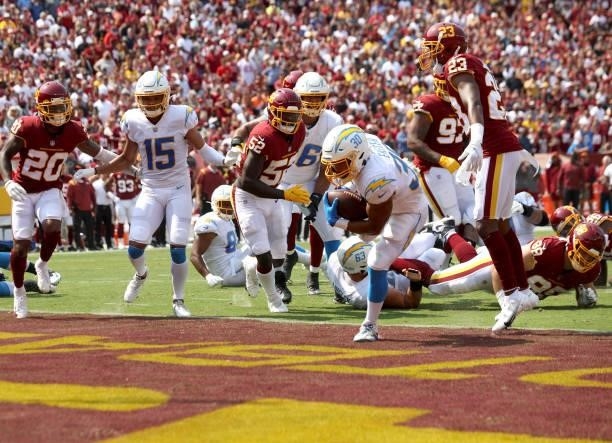 Austin Ekeler of the Los Angeles Chargers scores a touchdown on a 3-yard run against the Washington Football Team during the first quarter at...