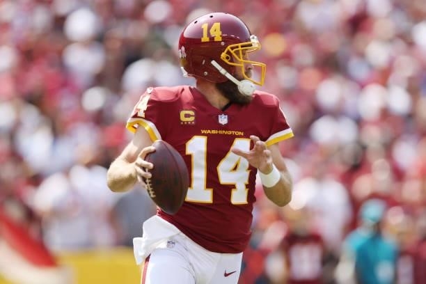 Ryan Fitzpatrick of the Washington Football Team looks to pass against the Los Angeles Chargers during the first half at FedExField on September 12,...