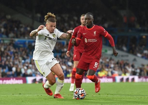 Naby Keita of Liverpool with Phillips of Leeds United during the Premier League match between Leeds United and Liverpool at Elland Road on September...