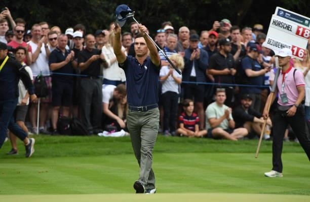 Billy Horschel acknowledges the applause after holing his birdie putt on the 18th green after his final round during Day Four of The BMW PGA...