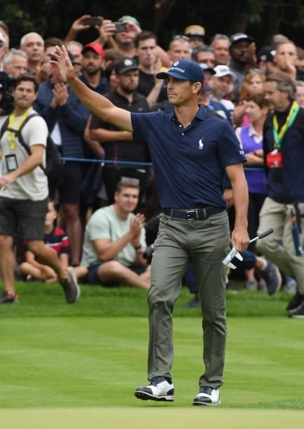 Billy Horschel acknowledges the applause after holing his birdie putt on the 18th green after his final round during Day Four of The BMW PGA...
