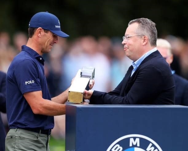 Billy Horschel of the United States of America is presented with the trophy, after winning the BMW PGA Championship during Day Four of The BMW PGA...