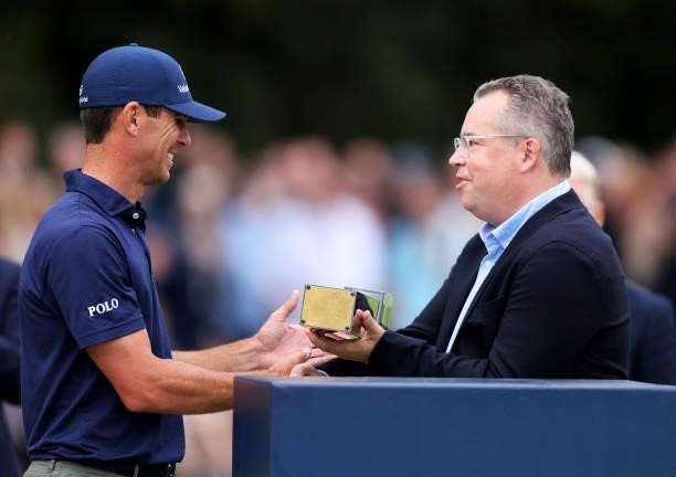 Billy Horschel of the United States of America is presented with the trophy, after winning the BMW PGA Championship during Day Four of The BMW PGA...