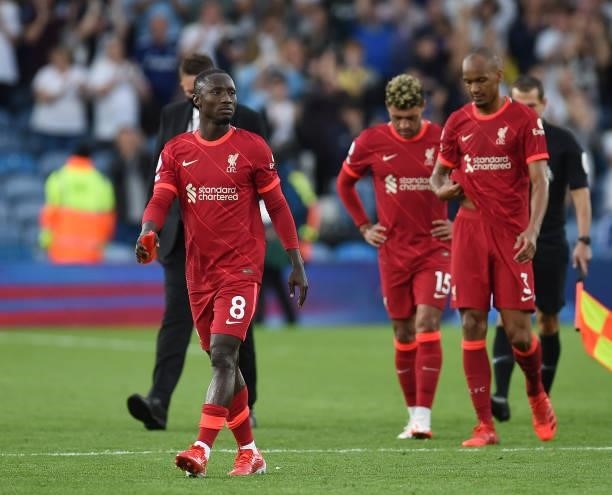 Naby Keita of Liverpool with Fabinho of Liverpool and Alex Oxlade-Chamberlain of Liverpool at the end of the Premier League match between Leeds...
