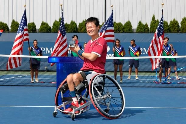 Shingo Kunieda of Japan celebrates with the championship trophy after defeating Alfie Hewett of Great Britain during his Wheelchair Men's Singles...
