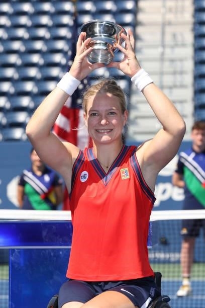 Diede de Groot of the Netherlands celebrates with the championship trophy after defeating Yui Kamiji of Japan and completing the 'Golden Slam' during...
