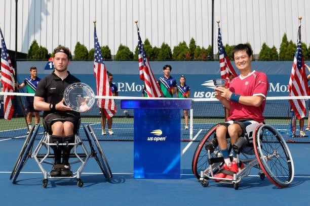 Alfie Hewett of Great Britain holds the runner-up trophy alongside Shingo Kunieda of Japan who celebrates with the championship trophy their...