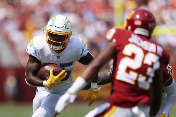 Larry Rountree III of the Los Angeles Chargers runs with the ball during the first quarter against the Washington Football Team at FedExField on...