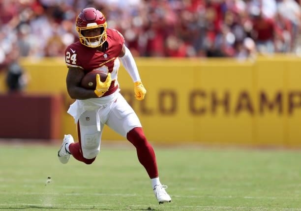 Antonio Gibson of the Washington Football Team runs with the ball during the first half against the Los Angeles Chargers at FedExField on September...