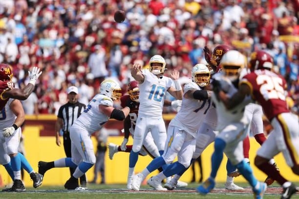 Justin Herbert of the Los Angeles Chargers throws a pass during the second quarter against the Washington Football Team at FedExField on September...