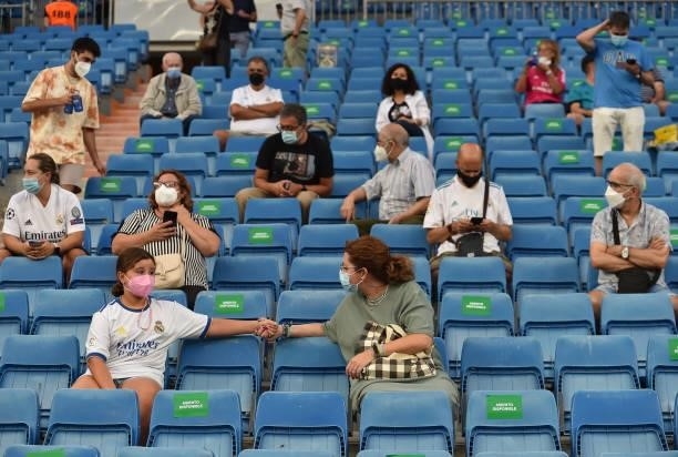 Fans take their seats before the La Liga Santander match between Real Madrid CF and RC Celta de Vigo at Estadio Santiago Bernabeu on September 12,...