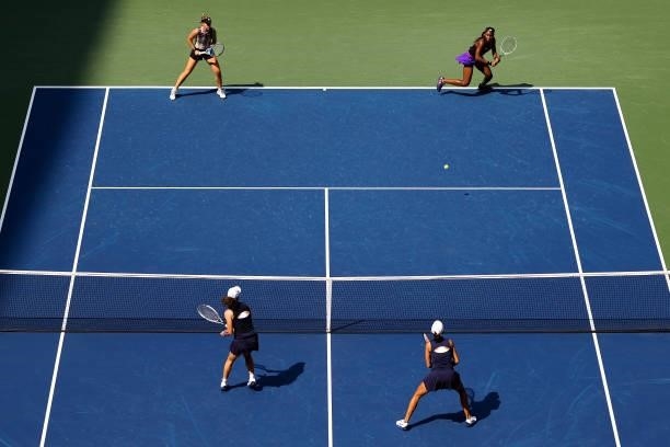 Coco Gauff of the United States and Catherine McNally of the United States return the ball against Samantha Stosur of Australia and Shuai Zhang of...
