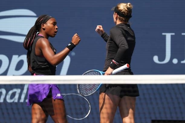 Coco Gauff of the United States and Catherine McNally of the United States react as they play against Samantha Stosur of Australia and Shuai Zhang of...