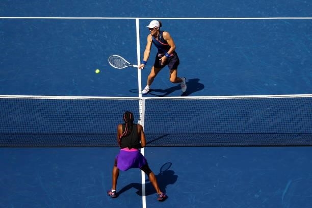 Samantha Stosur of Australia returns the ball alongside Shuai Zhang of China against Coco Gauff of the United States and Catherine McNally of the...