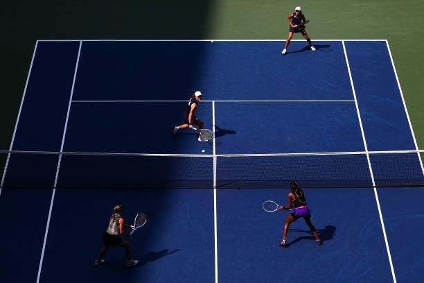 Samantha Stosur of Australia and Shuai Zhang of China return the ball against Coco Gauff of the United States and Catherine McNally of the United...