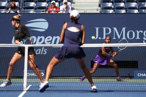 Coco Gauff of the United States looks to return the ball alongside Catherine McNally of the United States against Samantha Stosur of Australia and...