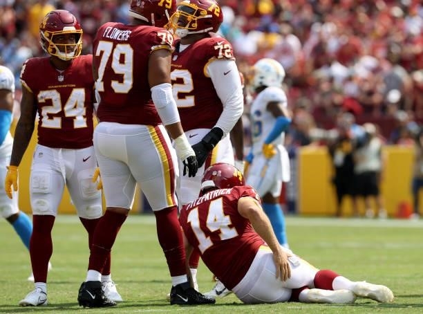Ryan Fitzpatrick of the Washington Football Team is injured during the first half against the Los Angeles Chargers at FedExField on September 12,...