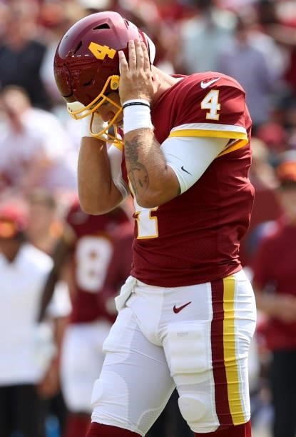 Taylor Heinicke of the Washington Football Team reacts against the Los Angeles Chargers during the first half at FedExField on September 12, 2021 in...